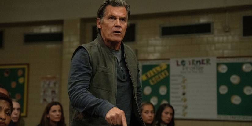 Josh Brolin in Weapons pointing his finger toward the ground. 