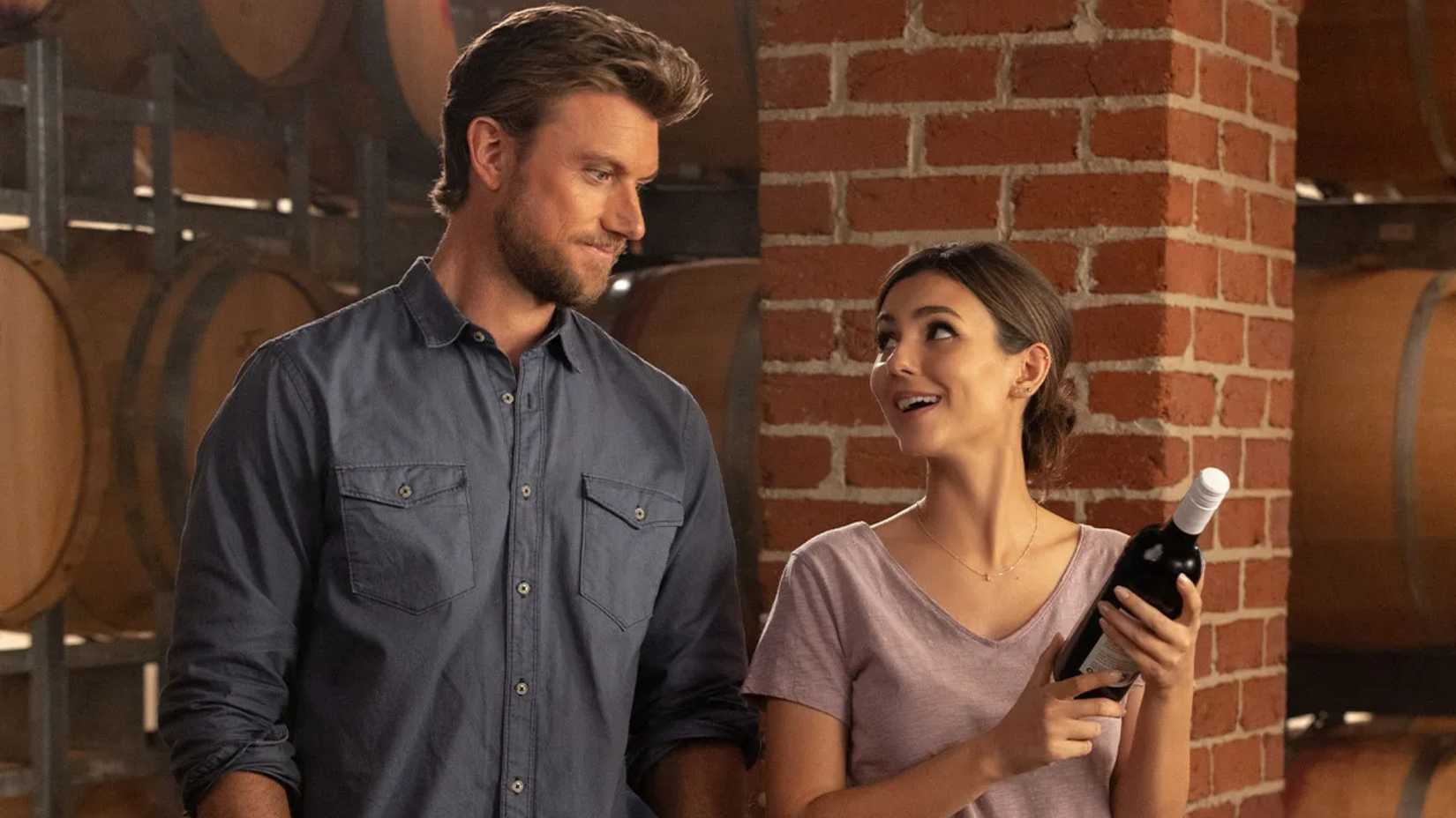 A couple look at a bottle of wine in A Perfect Pairing