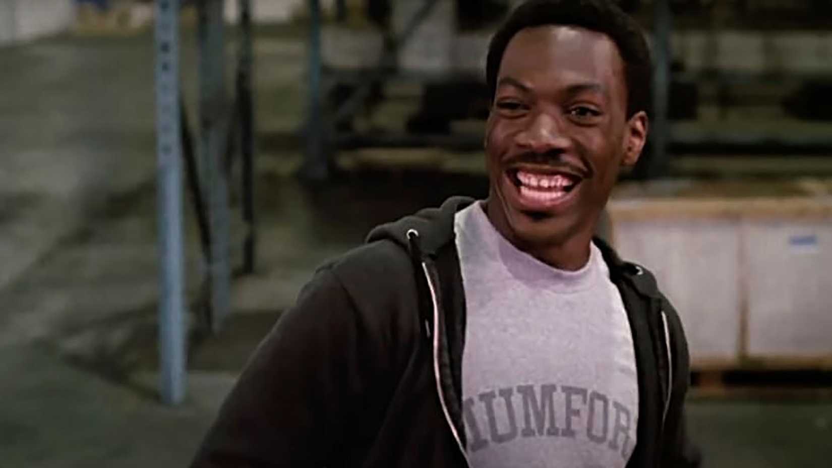 Axel smiling wearing a hoodie in Beverly Hills Cop.
