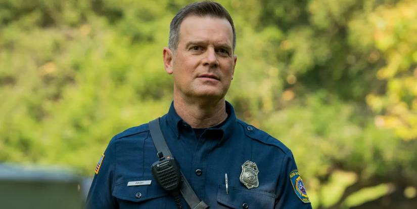 Bobby stands by trees in 9-1-1