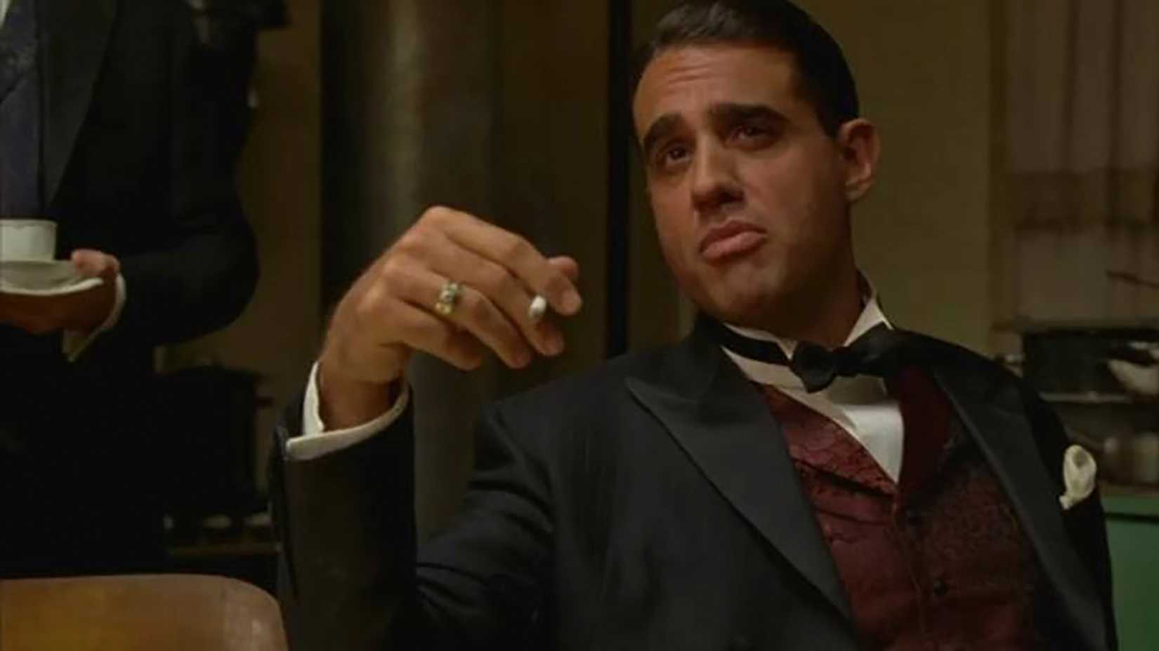 Bobby Cannavale sitting back smoking in Boardwalk Empire.