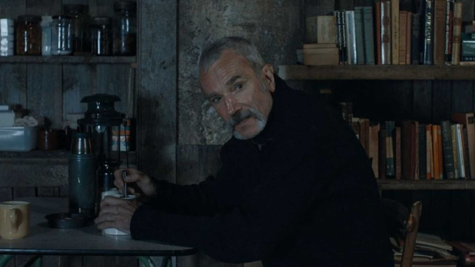 Daniel Day-Lewis in Anemone sitting at a table