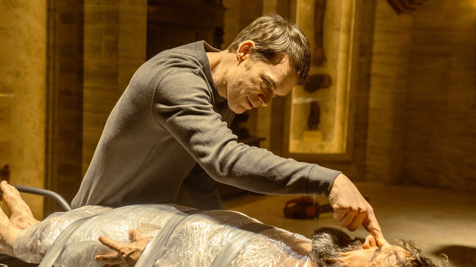 Leon on Dexter's table, Dexter pushing his finger into his head in Dexter: Resurrection.