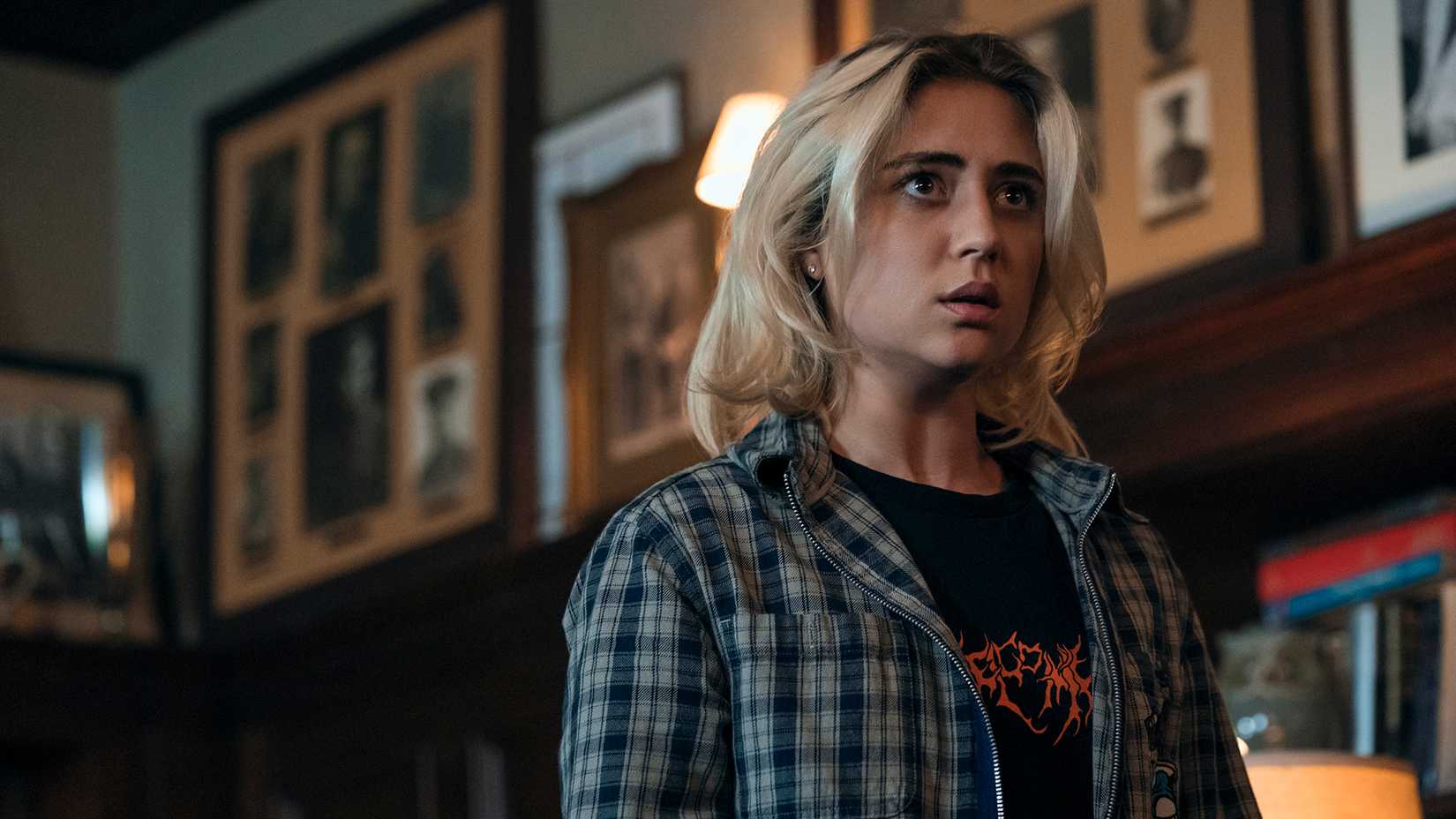 Emma looking worried in Gen V in an office.