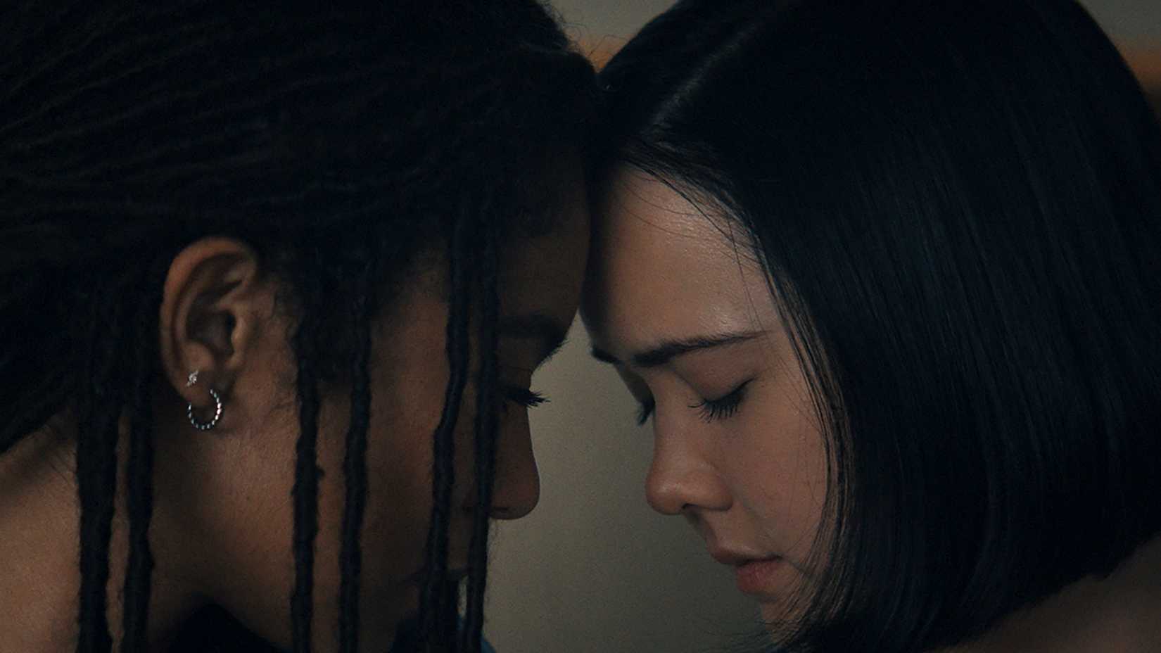 Marie and Jordan with their forehead together in Gen V.