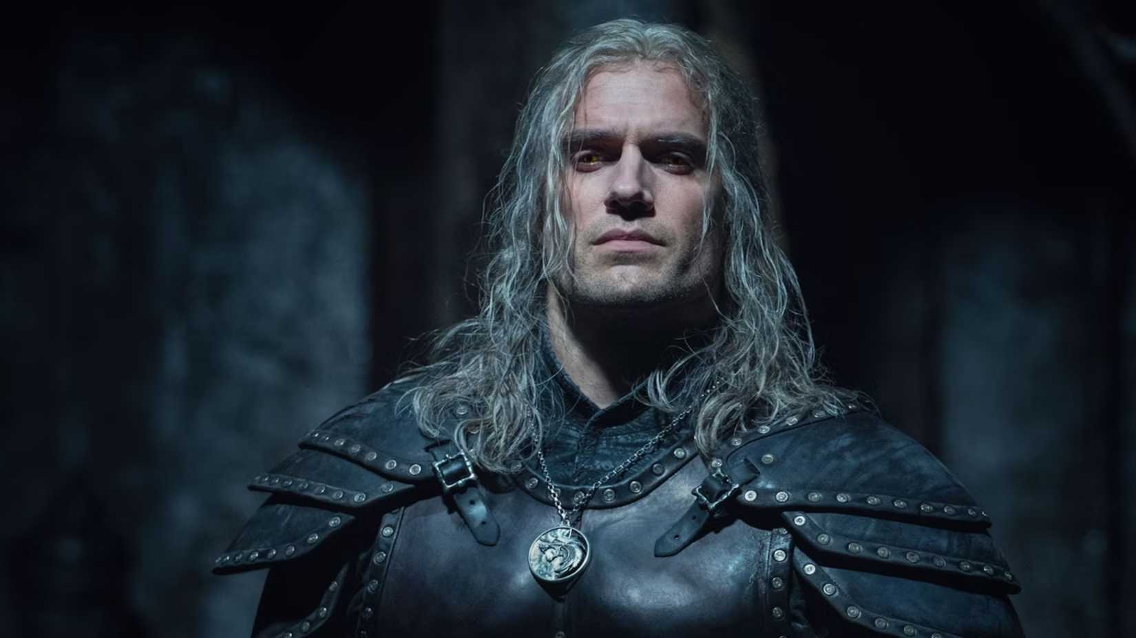 Henry Cavill stars in The Witcher wearing black armor