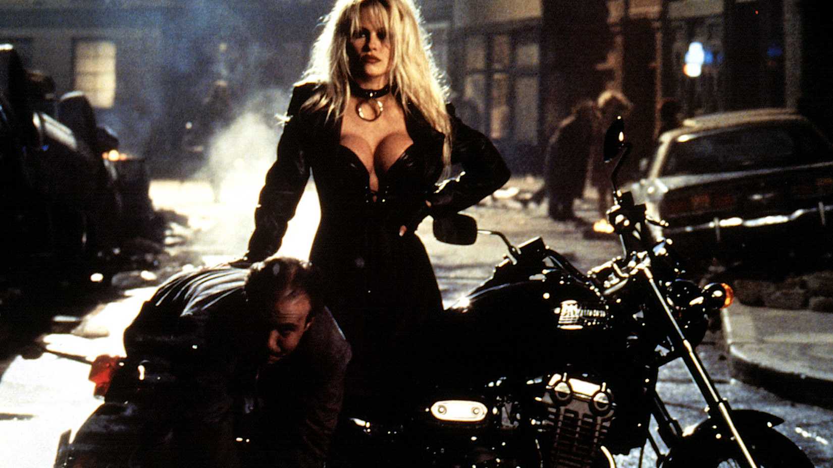 Pamela Anderson on a Bike in Barb Wire