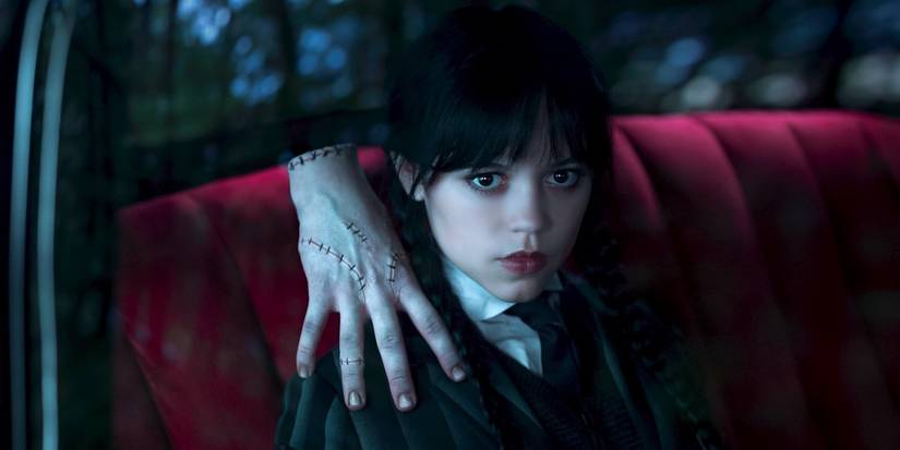 Jenna Ortega's Wednesday Addams with Thing on her shoulder in Netflix's Wednesday