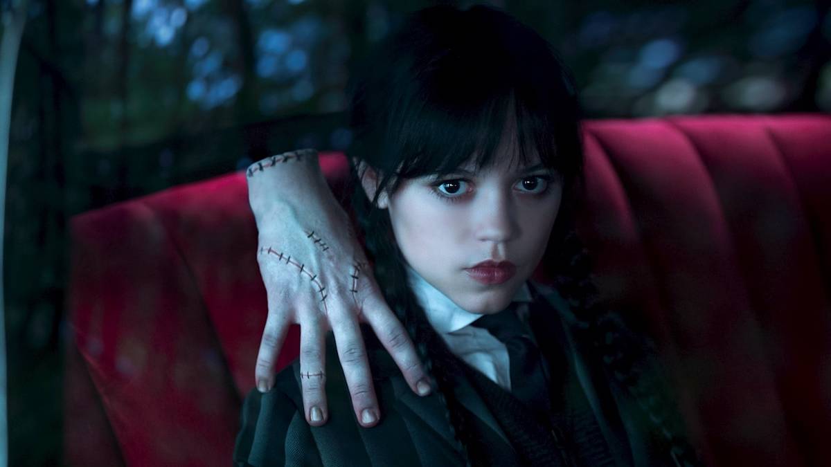 Jenna Ortega's Wednesday Addams with Thing on her shoulder in Netflix's Wednesday