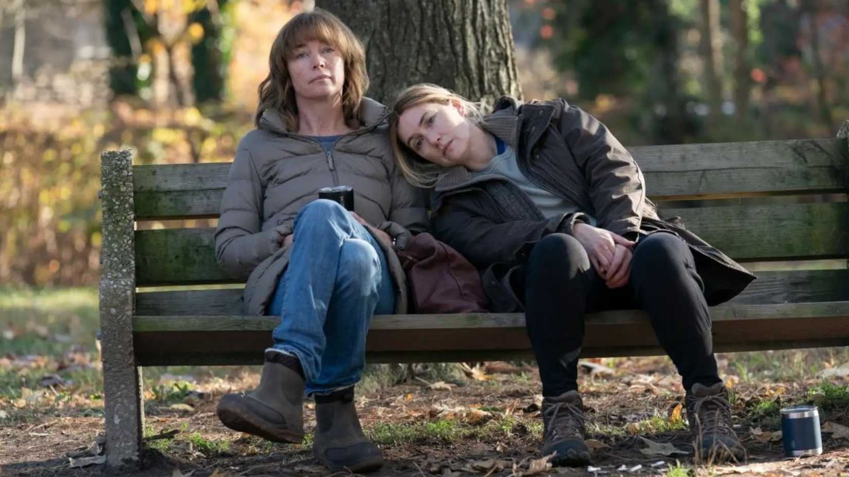 Kate Winslet in Mare of Easttown sitting on a bench