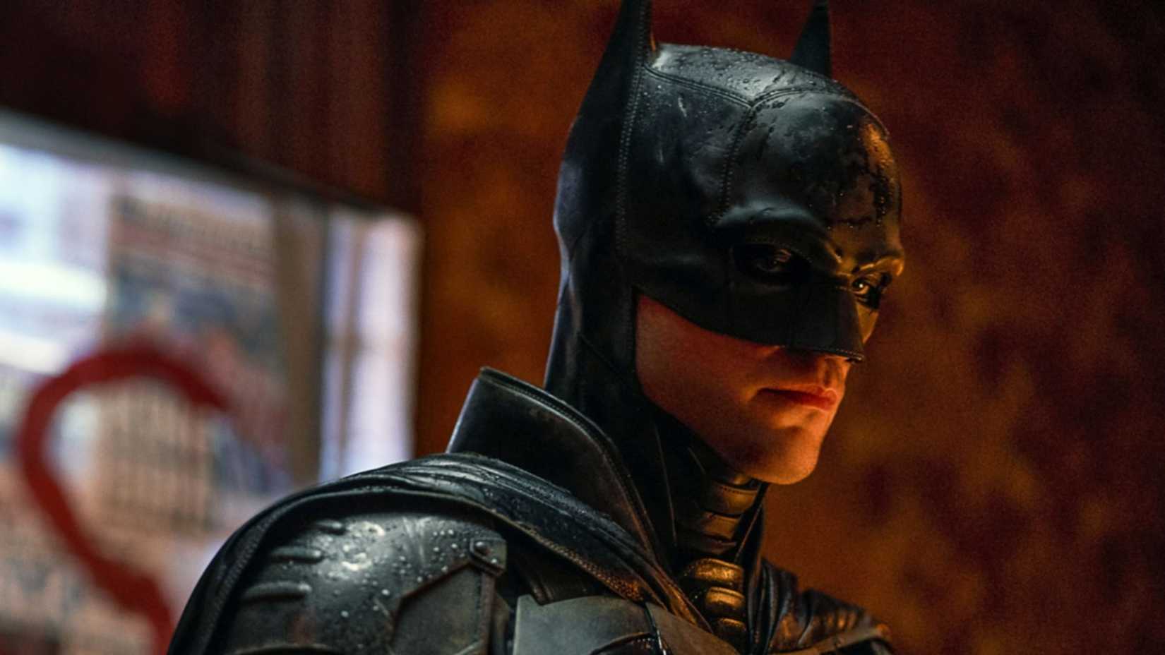 Robert Pattinson in The Batman looking down at something