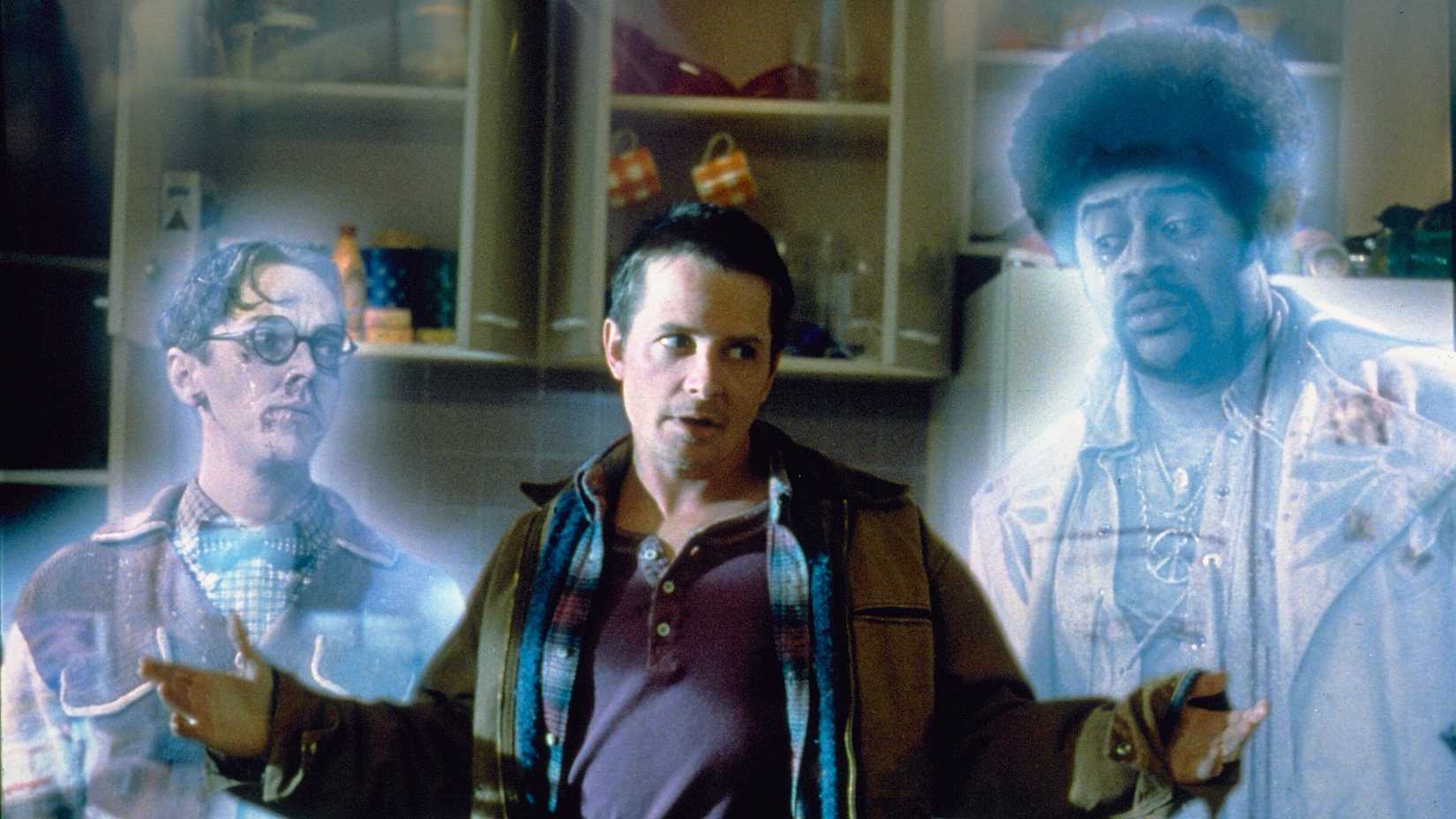 Michael j. fox with two ghosts beside him in the frighteners