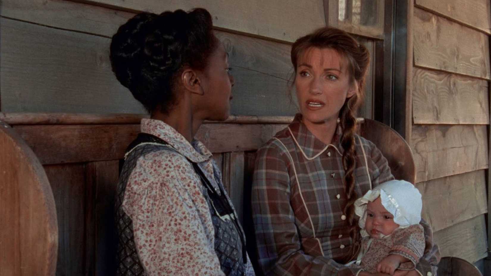 Michaela holding a baby in Dr. Quinn, Medicine Woman