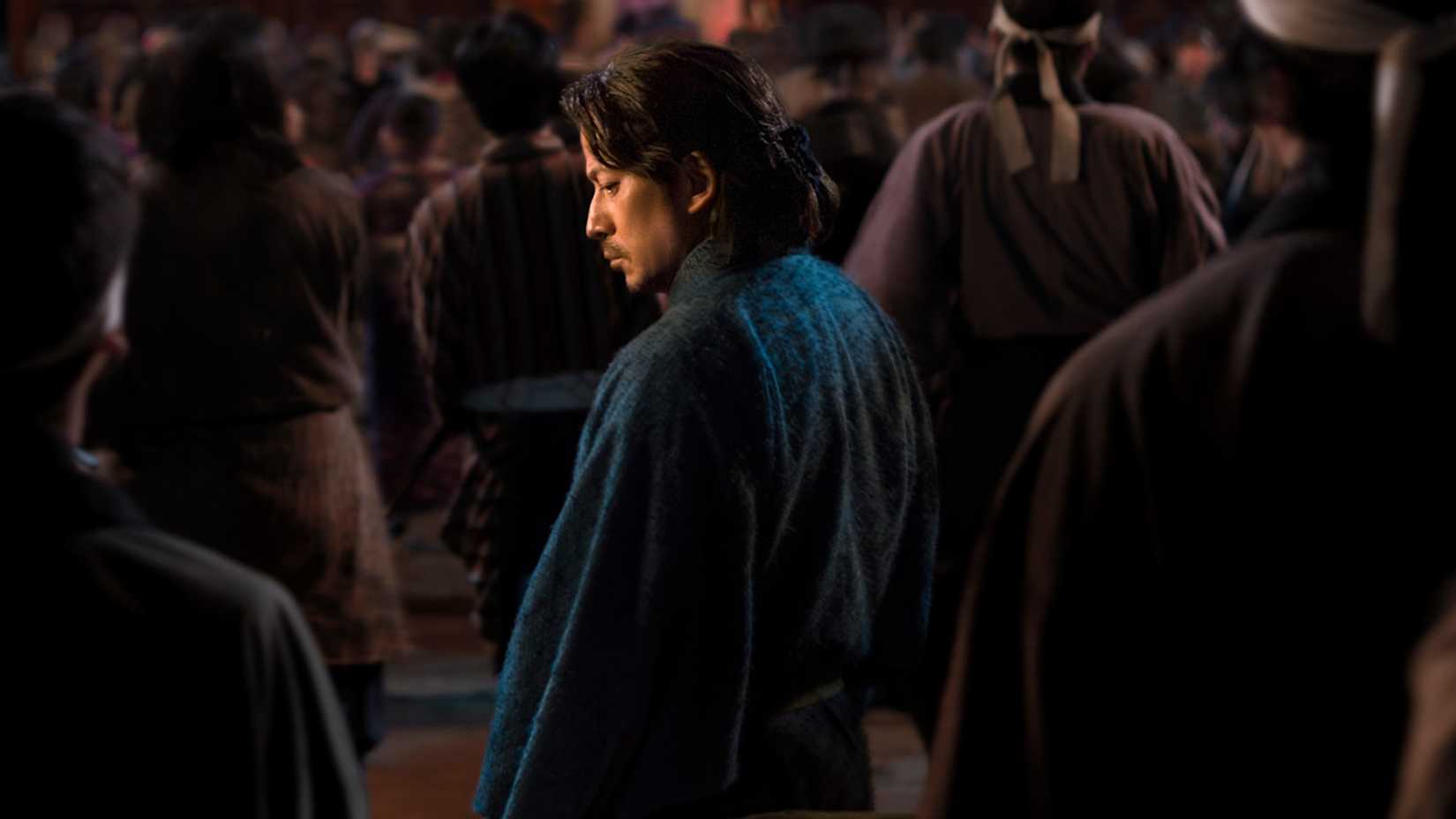 Still from Last Samurai Standing with a man standing in a crowd