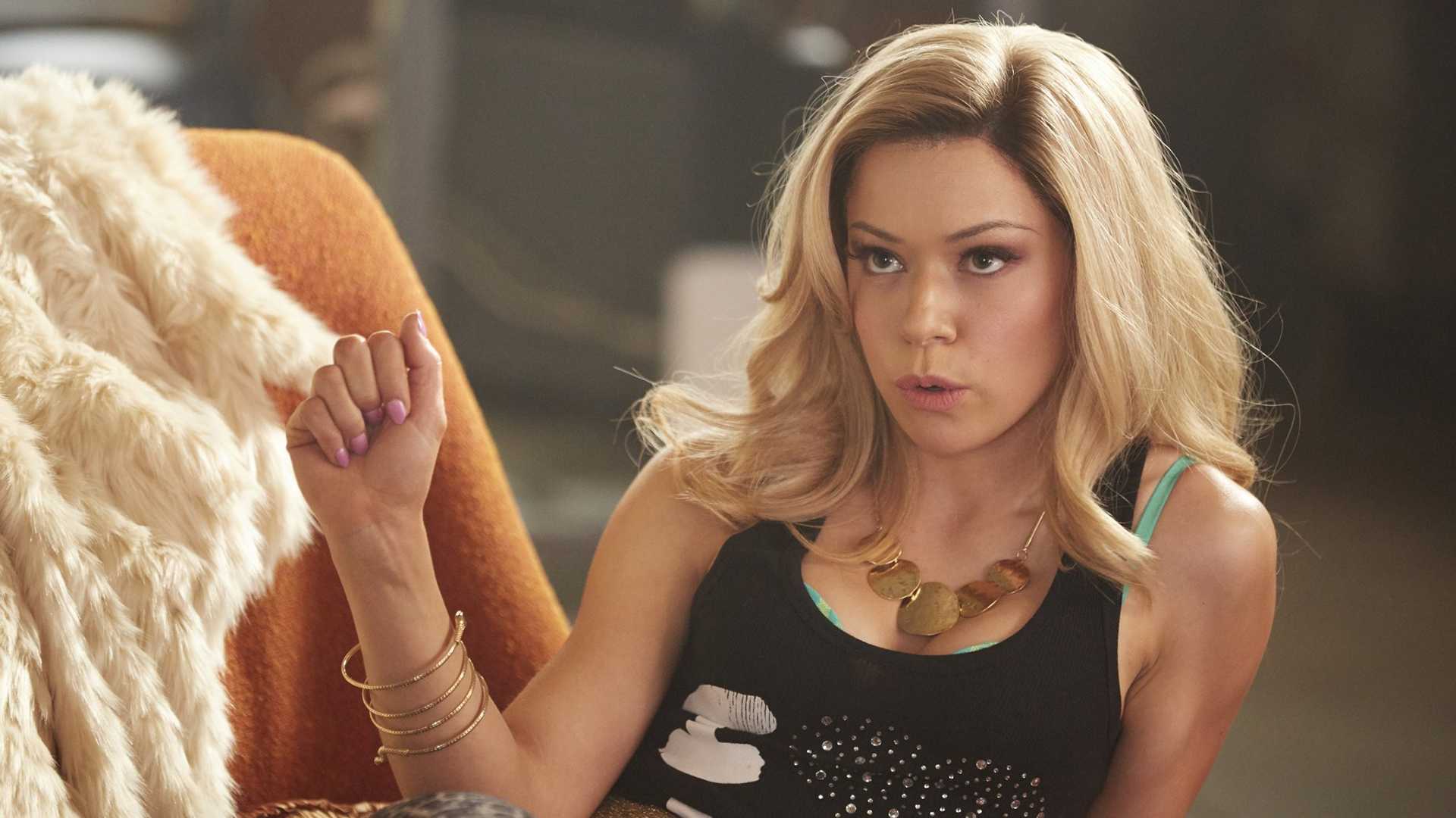 Krystal leaning back looking unimpressed in Orphan Black.