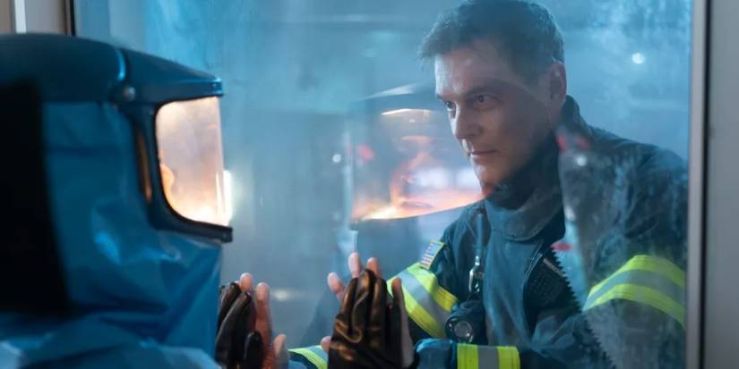 Bobby touches a glass window in 9-1-1