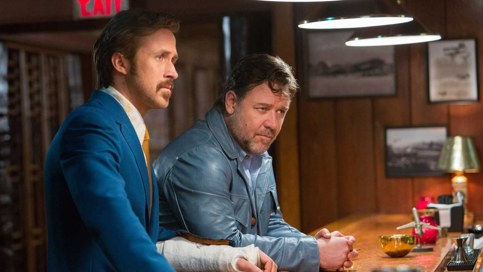 Jackson Healy and Holland March at a hotel bar in The Nice Guys