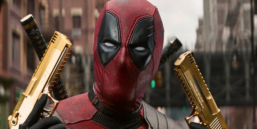 Ryan Reynolds with gold pistols in Deadpool & Wolverine
