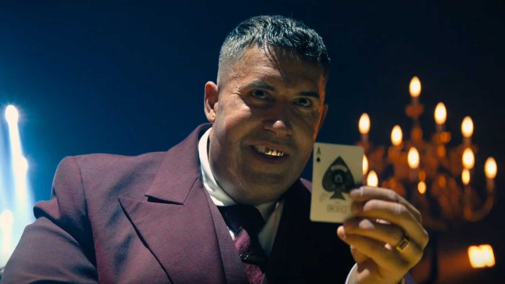 Killa holds up the ace of spades in John Wick: Chapter 4