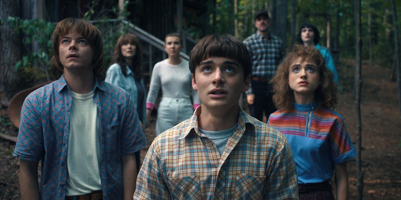 Charlie Heaton's Jonathan Byers, Noah Schnapp's Will Byers and Natalia Dyer's Nancy Wheeler looking up in Stranger Things Season 4