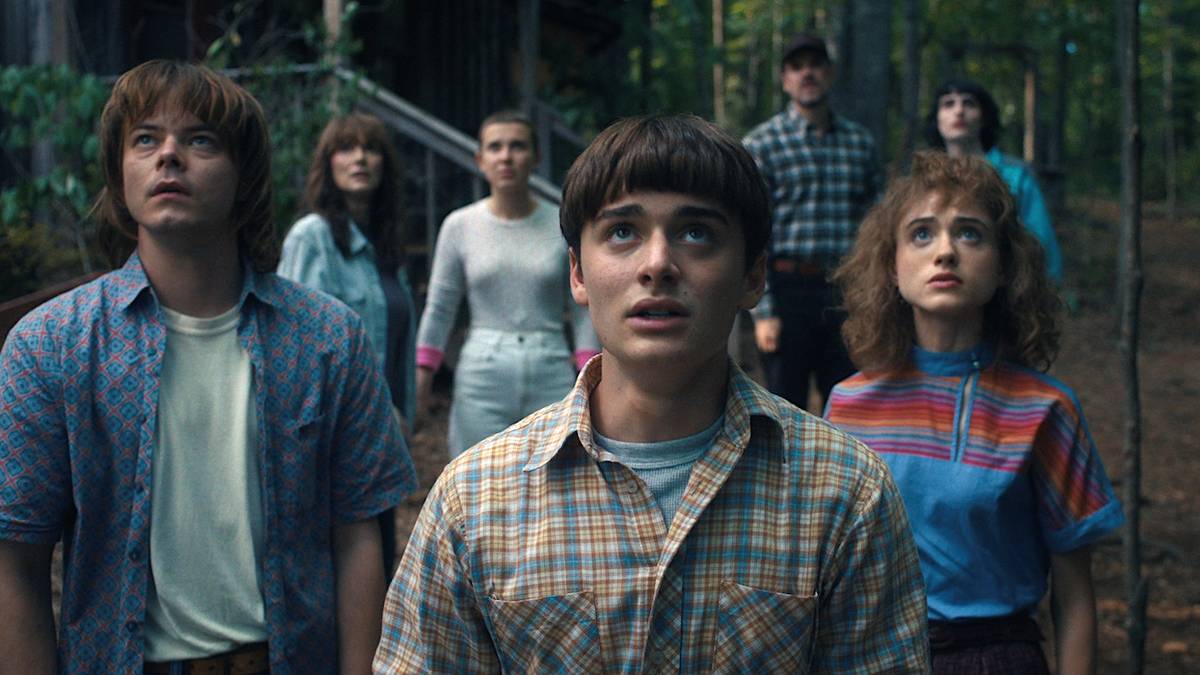 Charlie Heaton's Jonathan Byers, Noah Schnapp's Will Byers and Natalia Dyer's Nancy Wheeler looking up in Stranger Things Season 4