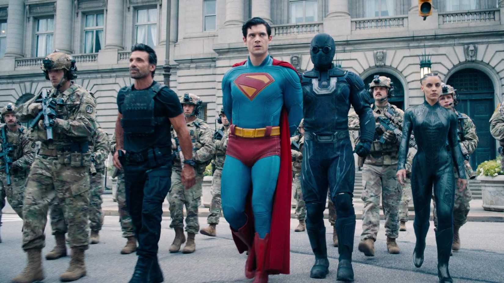 David Corenswet and Frank Grillo in Superman with his hands cuffed behind his back