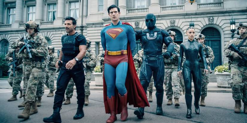 Superman in handcuffs walking with soldiers in Superman