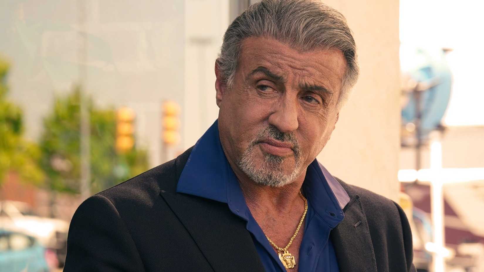 Sylvester Stallone in Tulsa King looking off to the side