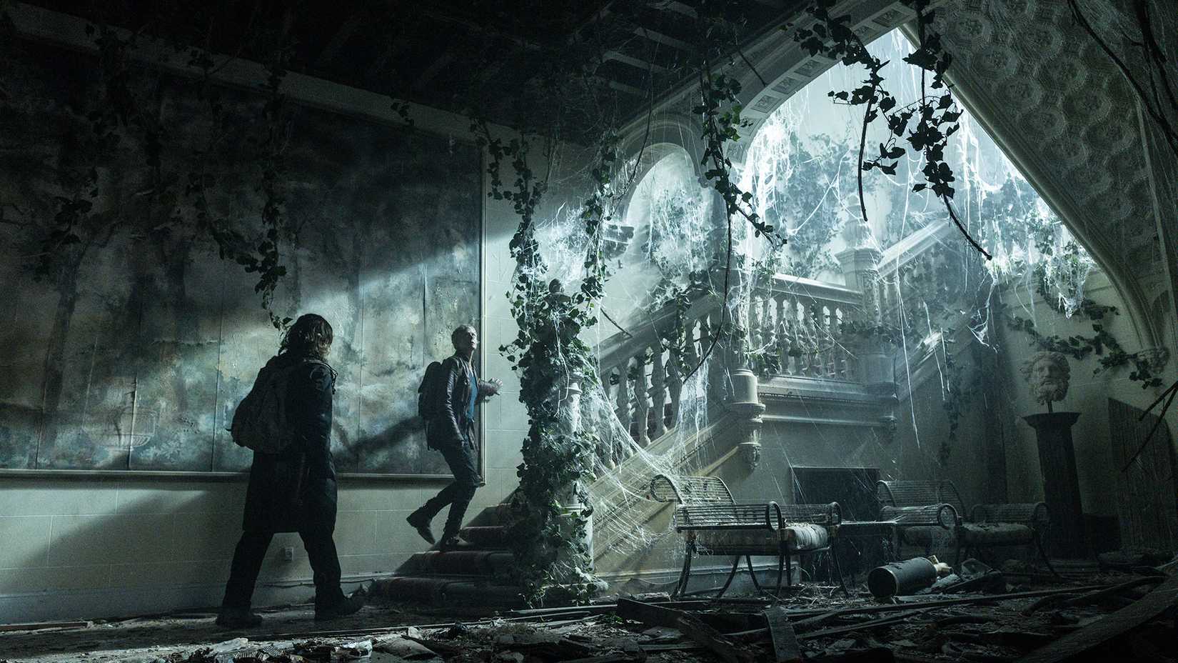 Daryl and Carol walking up stairs into a building in The Walking Dead: Daryl Dixon.
