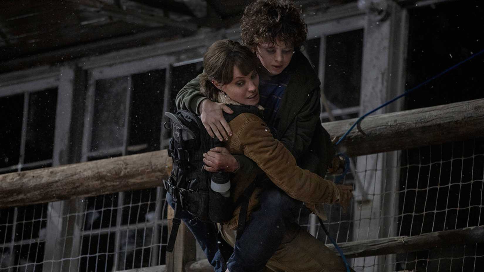 Hannah holds Cooper in Those Who Wish Me Dead