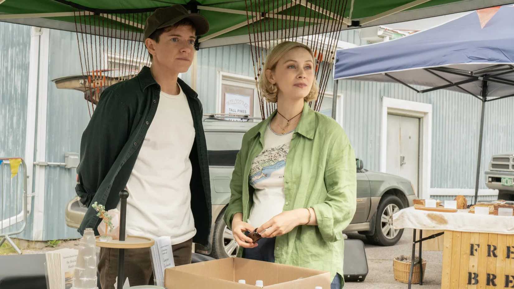 Alex and Laura stand outside in Wayward