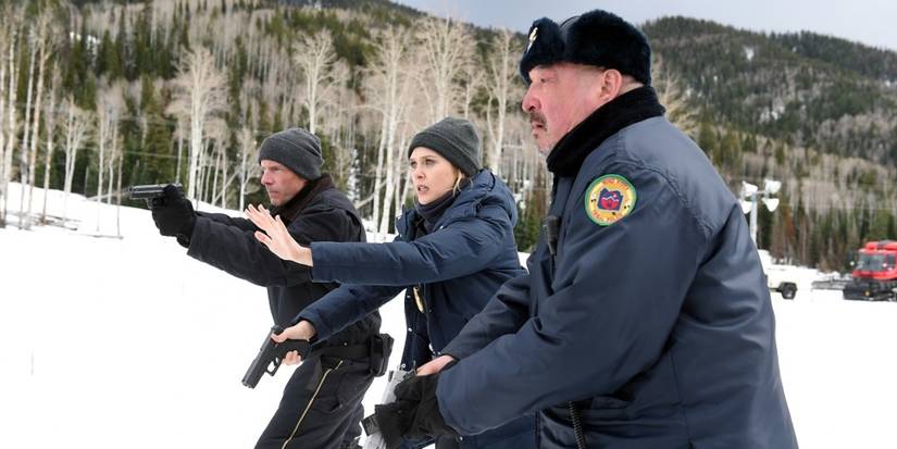 Ben and Jane hold guns in Wind River