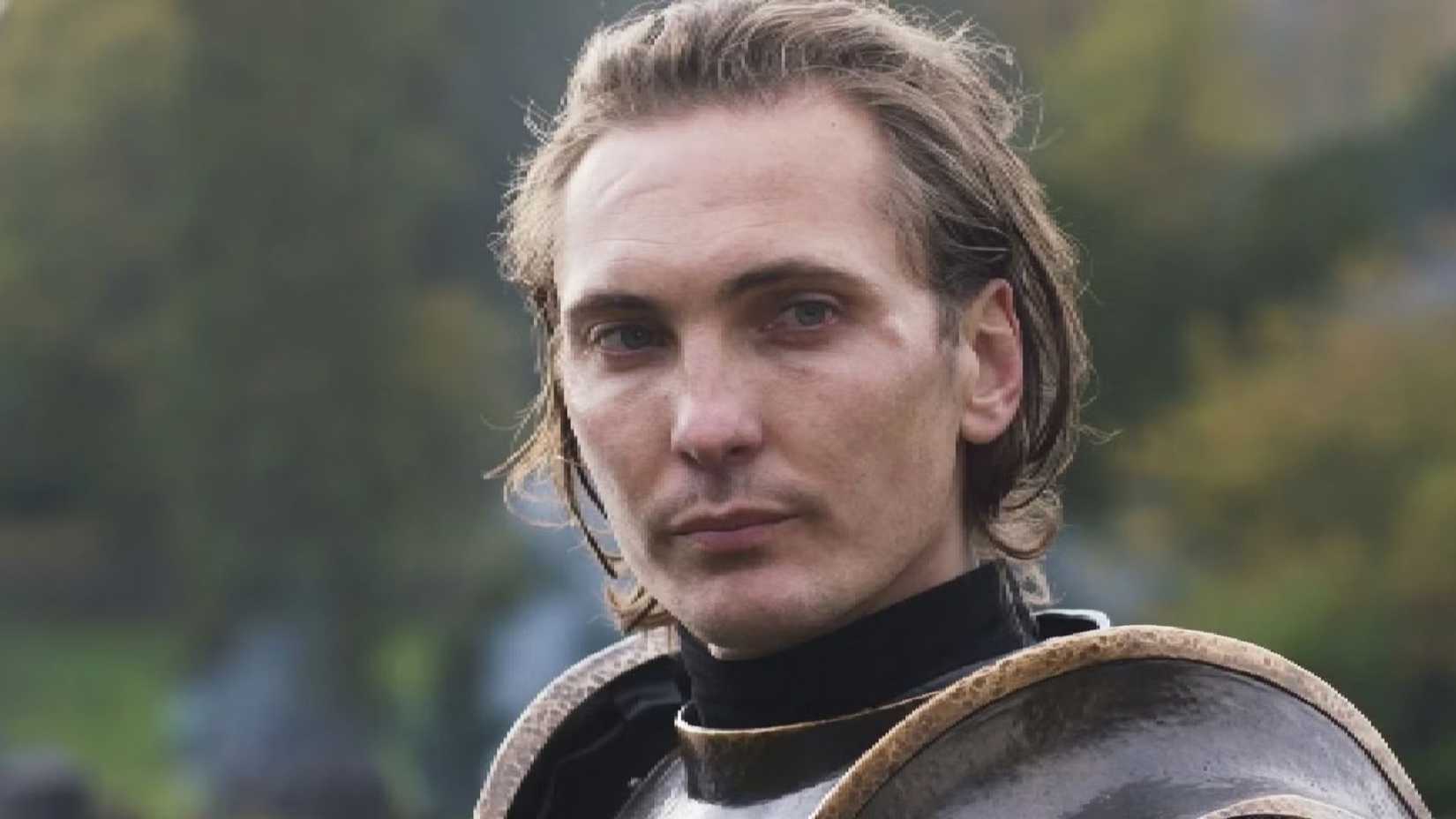 Cahir in The Witcher wearing armor looking off to the side