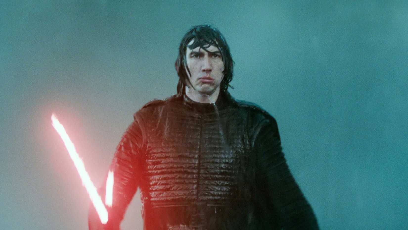 Adam Driver as Kylo Ren in Star Wars The Rise of Skywalker holding a red lightsaber