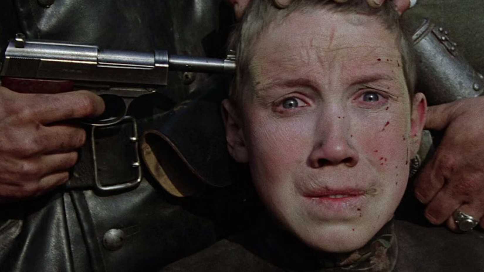 Aleksei Kravchenko in Come and See with a gun to his head