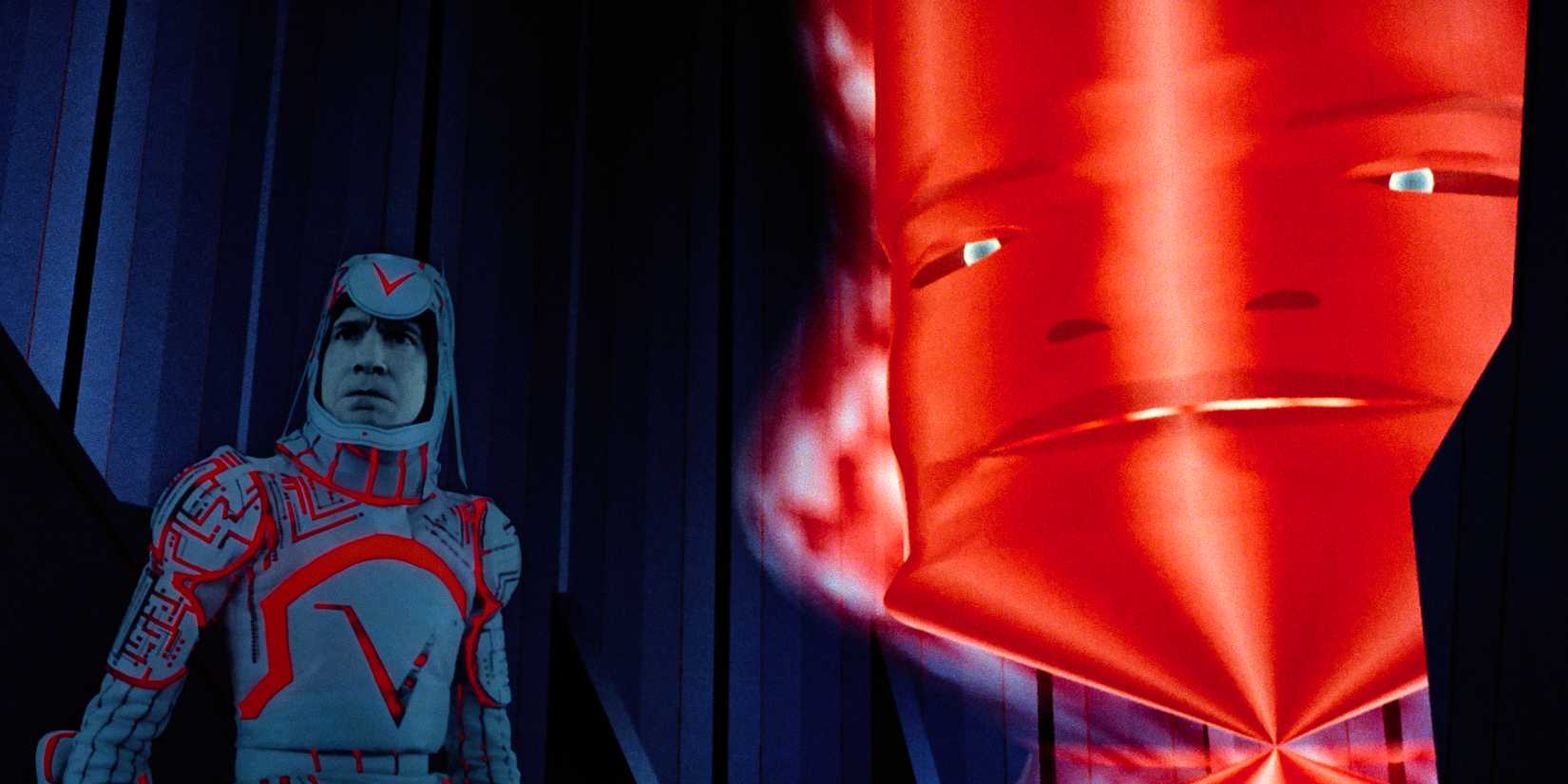 David Warner as Sark and the Master Control Program in Tron