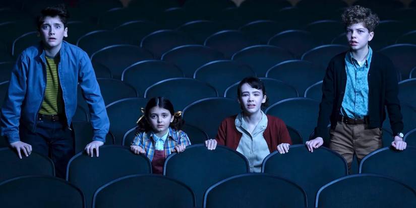 The kids pose in the movie theater in It: Welcome to Derry