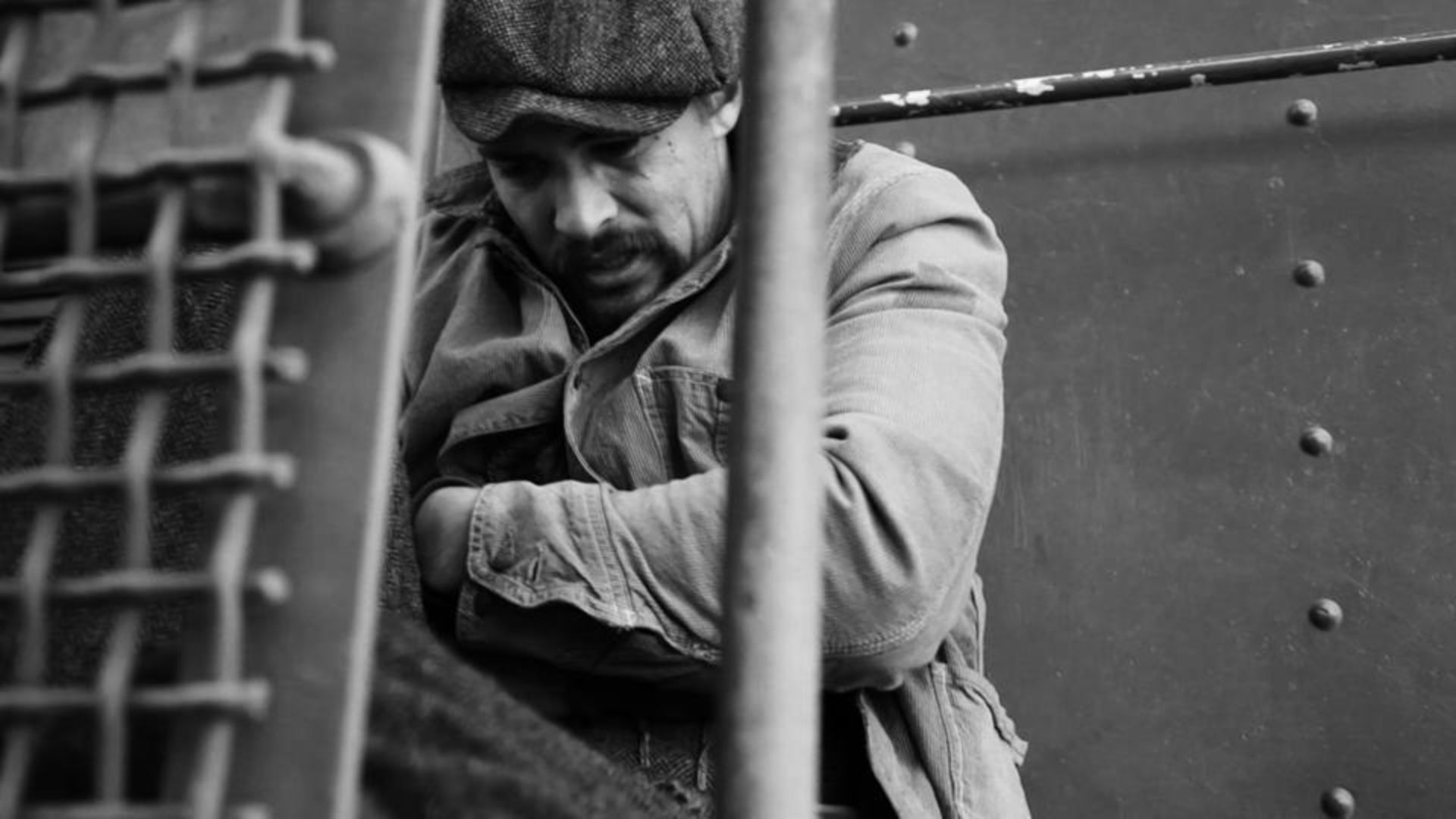 Jason Momoa's Mike hiding with his guitar in Brown Bag Diaries: Ridin' the Blinds in B Minor