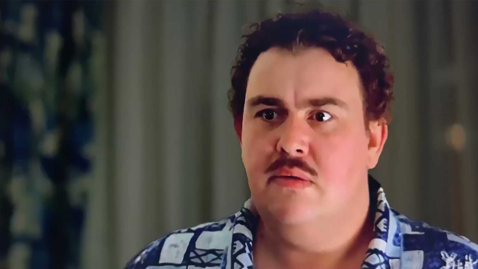 John Candy looking serious in Planes, Trains and Automobiles