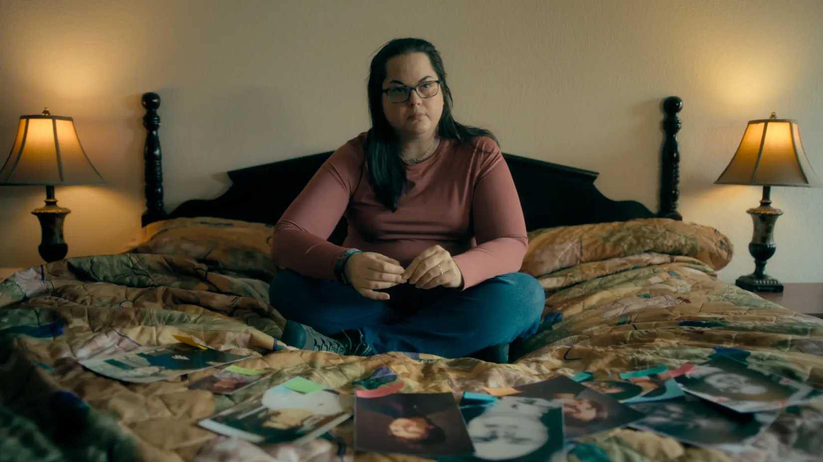 Kerri sits on her bed in My Father, The BTK Killer