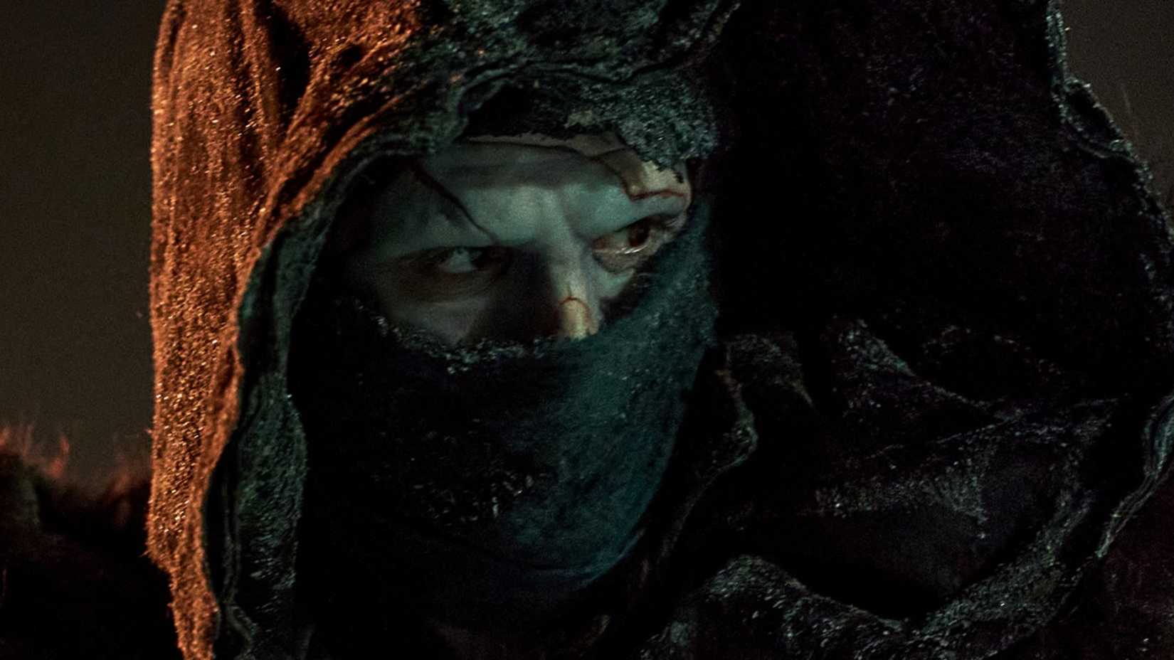 Jacob Elordi as The Monster in Frankenstein looking at something off-screen