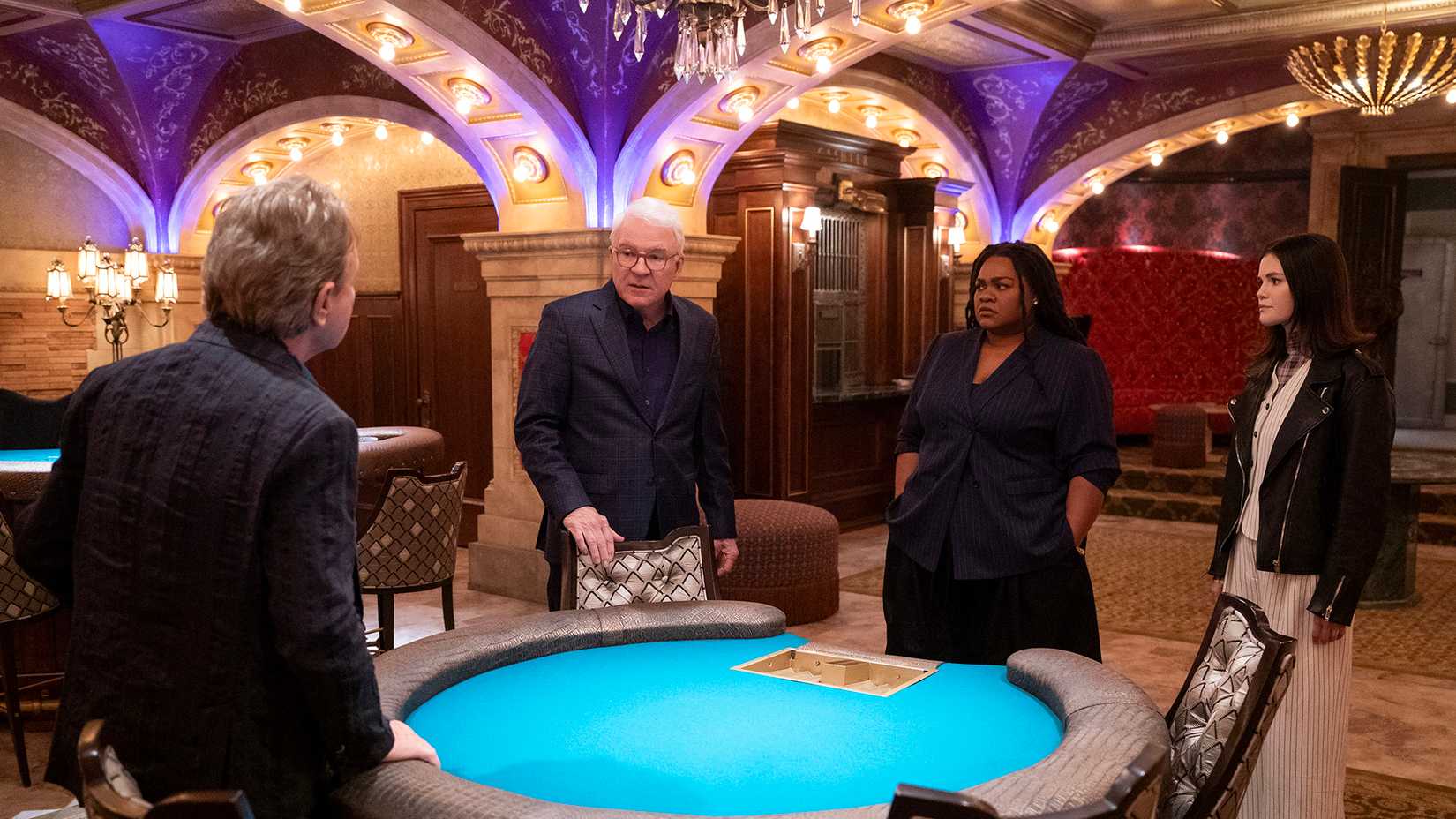 Oliver, Charles, Detective Williams, and Mabel in the casino at the Arconia in Only Murders in the Building.