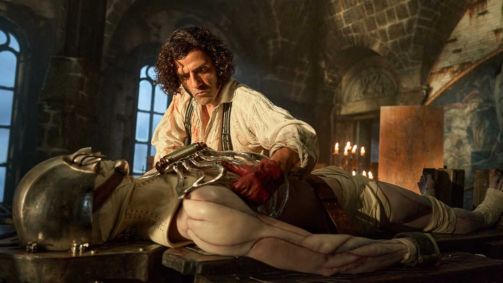 Oscar Isaac in Frankenstein working on the Monster