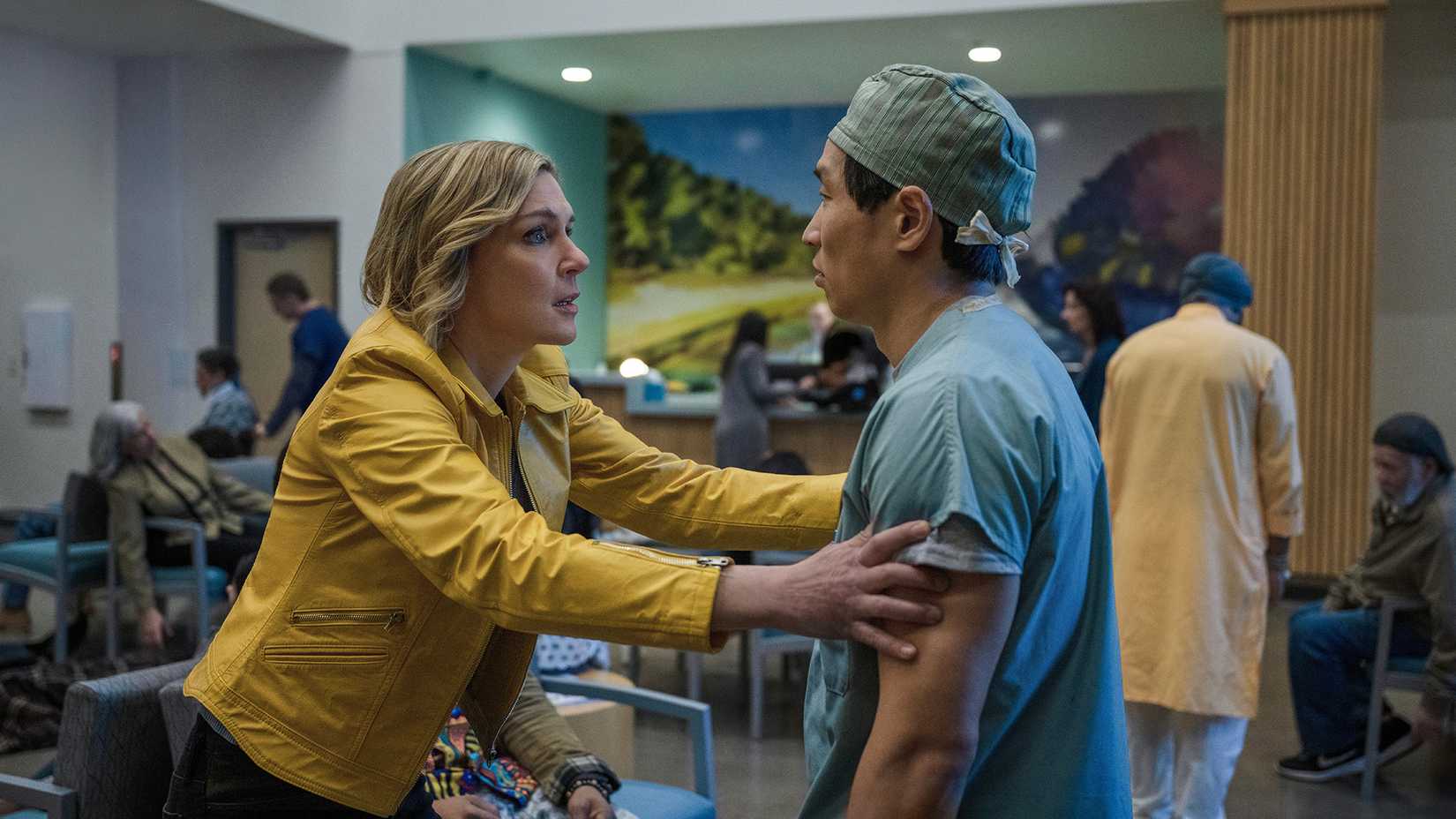 Carol pleading with a doctor in scrubs in the hospital in Pluribus.