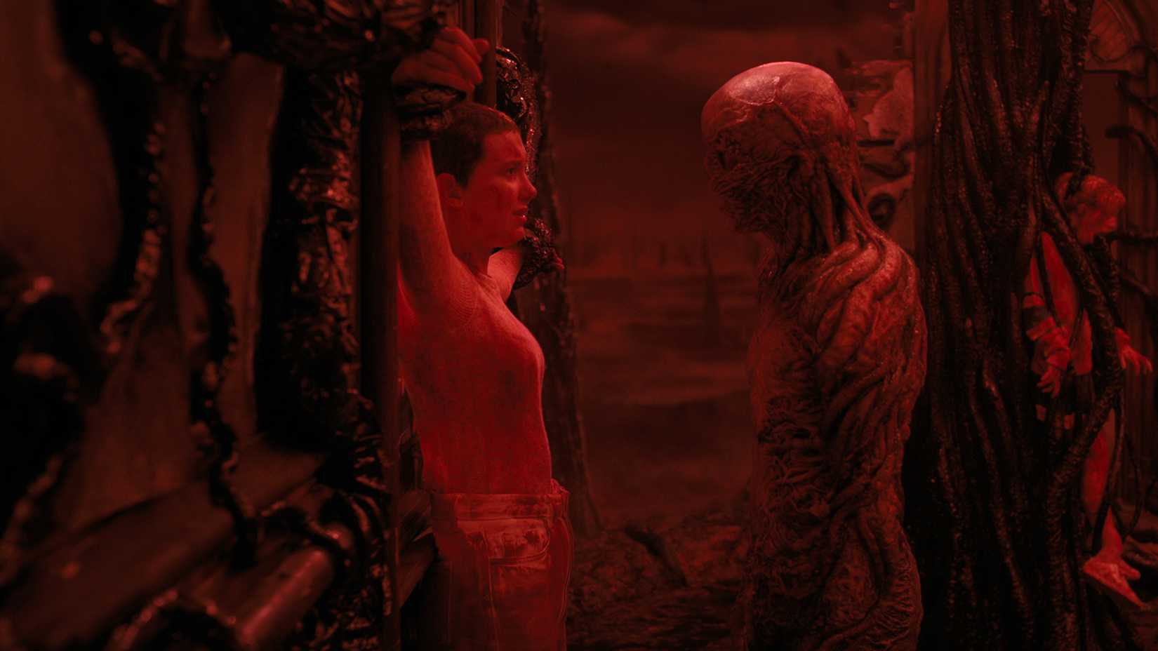 Vecna talking to Eleven who is trapped in the Upside Down in Stranger Things.