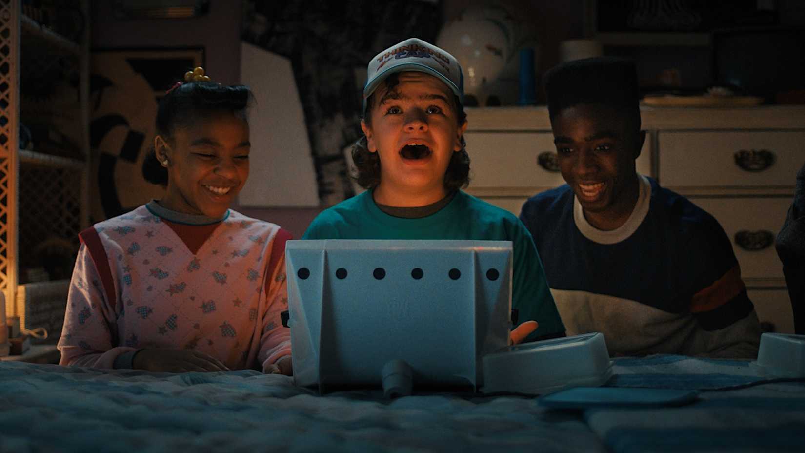 Priah Ferguson's Erica Sinclair, Gaten Matarazzo's Dustin Henderson and Caleb McLaughlin's Lucas Sinclair in Stranger Things Season 4