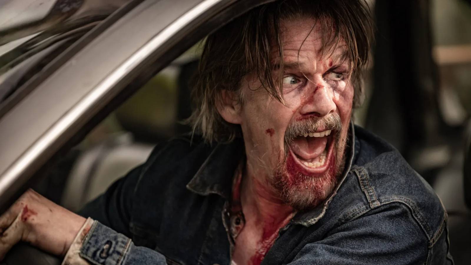 Lee screams with a bloody face in The Lowdown