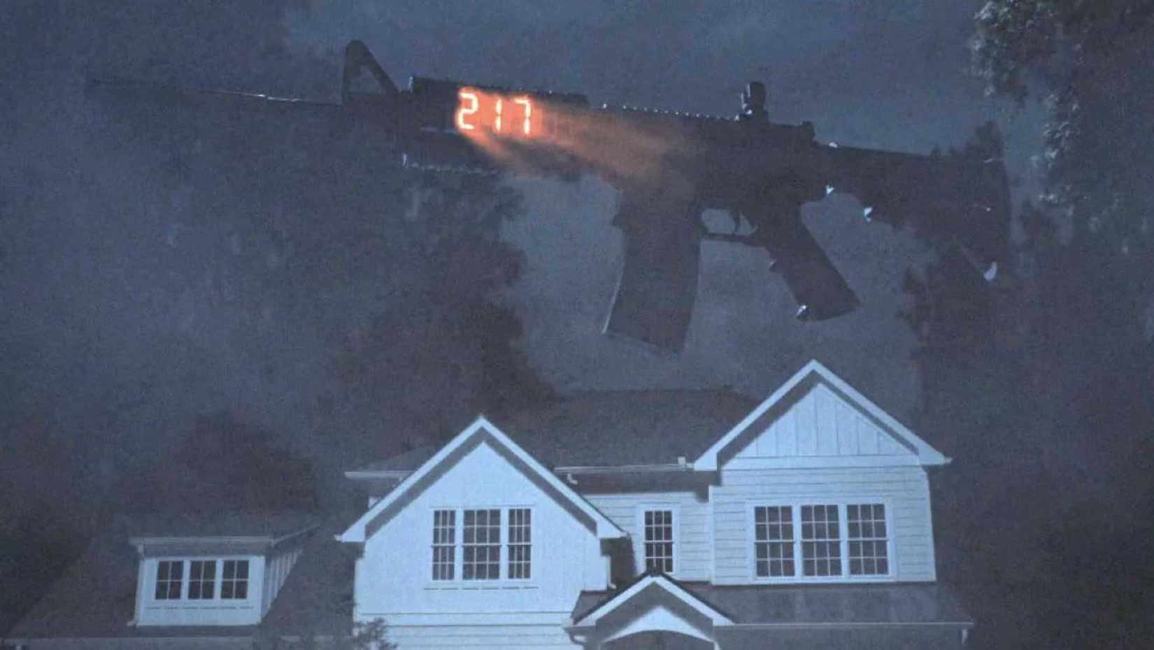 A rifle floats above a house in Weapons