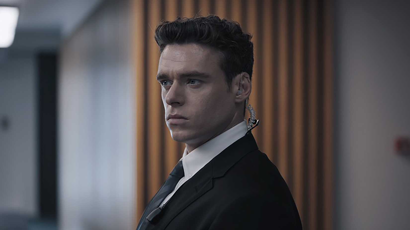 David standing in a suit in Bodyguard.