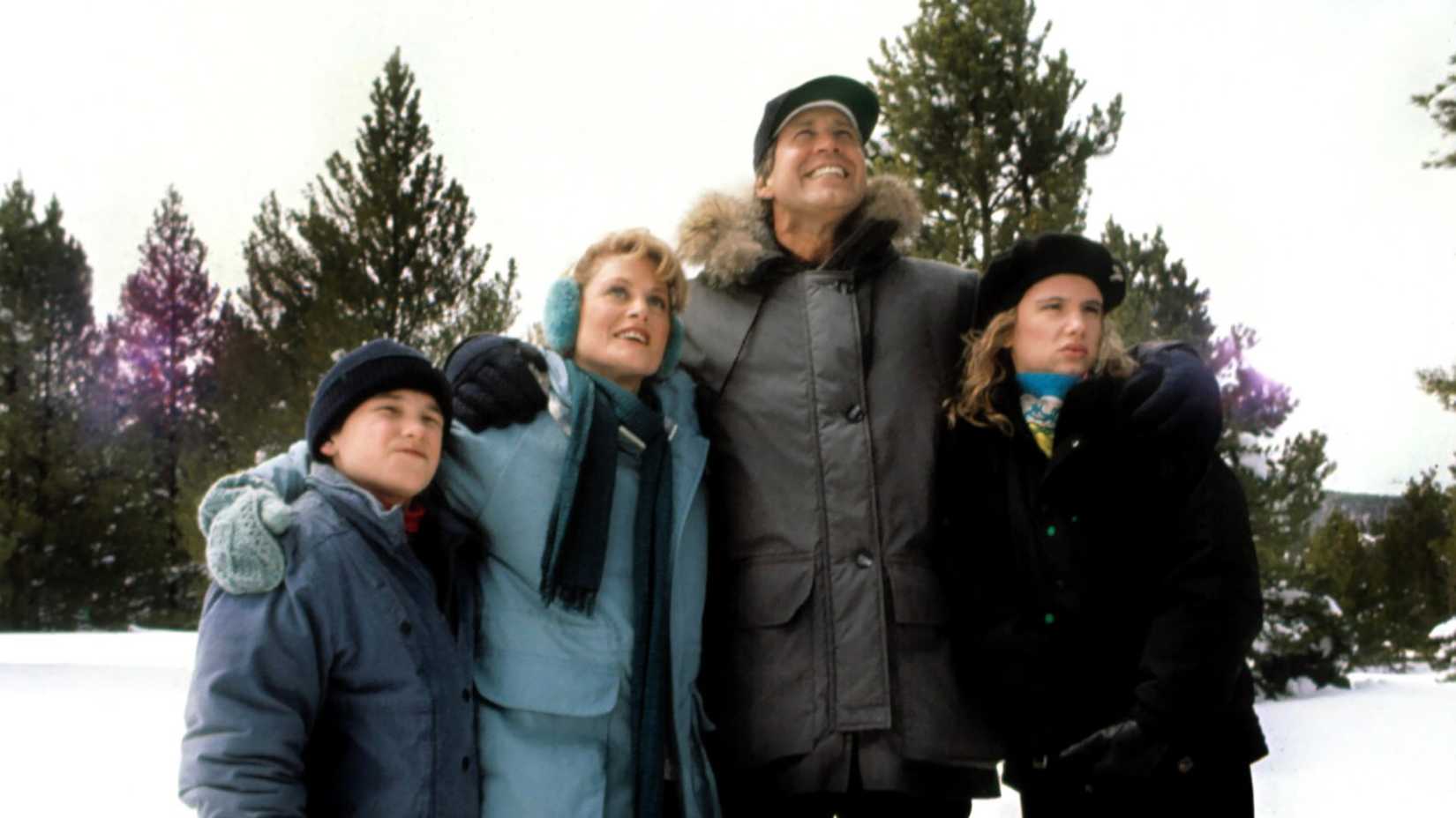 The Griswolds standing in the snow looking up in National Lampoon's Christmas Vacation.